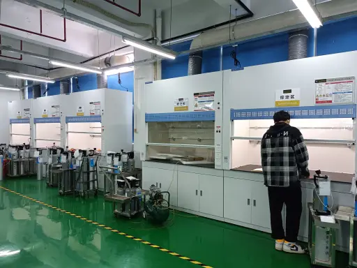 Calibration area with a row of extraction hoods and test gas cylinders