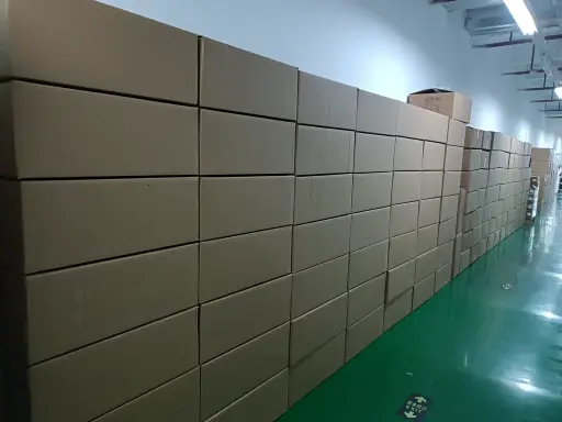 Wall of packed cartons in the on-site warehouse