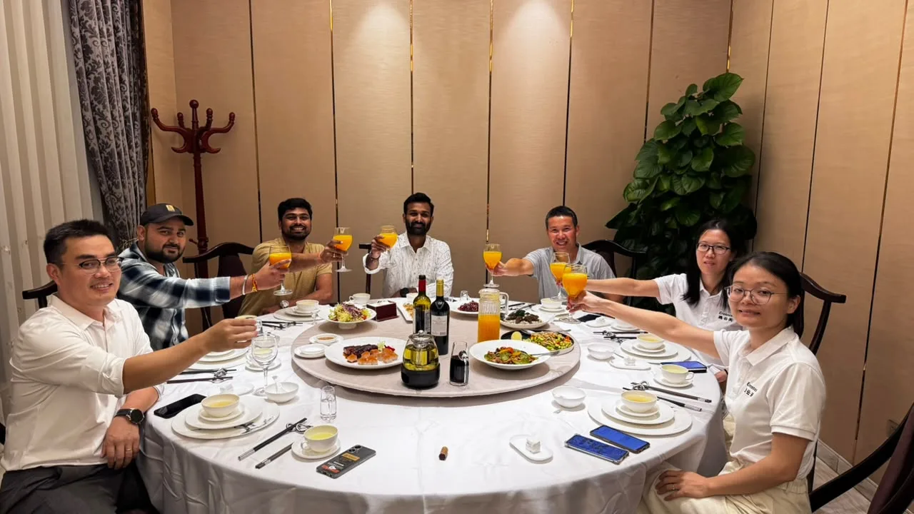 Eranntex representatives and visitors seated around a dining table.
